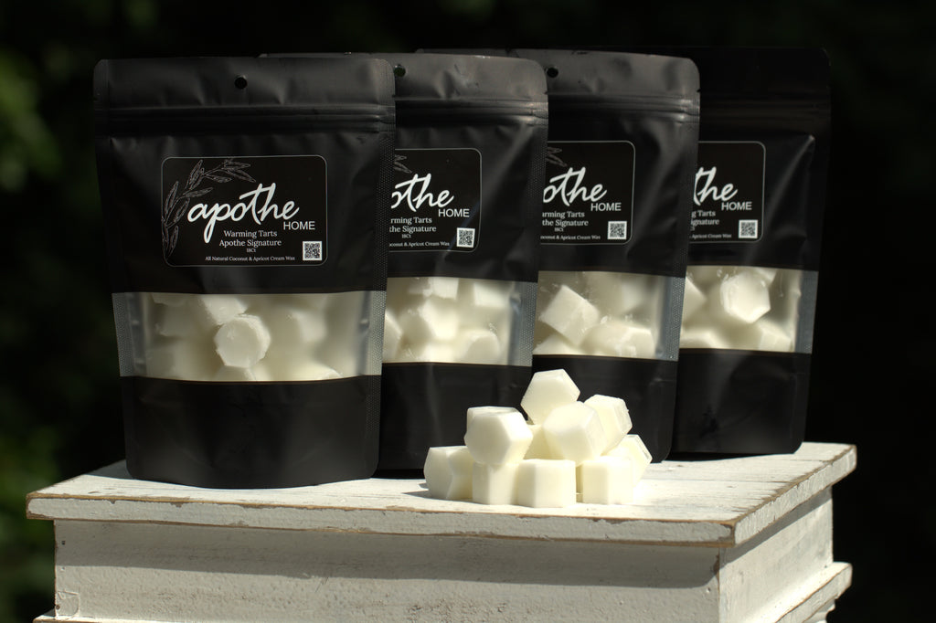 Bags of Apothe's Warming Tarts featuring our signature home scents of Apothe, Eucalyptus Tea, Blackberry Sage, Peppered Rosemary and Suede.