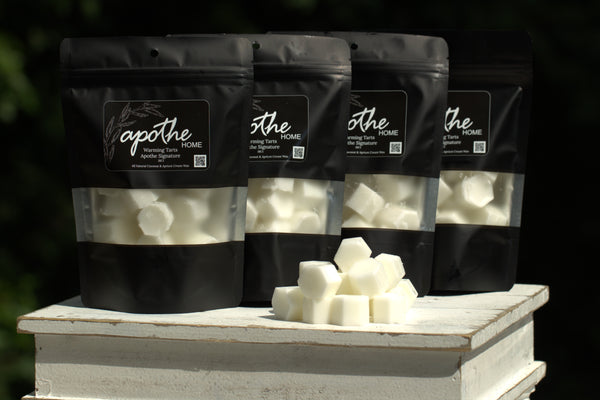 Bags of Apothe's Warming Tarts featuring our signature home scents of Apothe, Eucalyptus Tea, Blackberry Sage, Peppered Rosemary and Suede.
