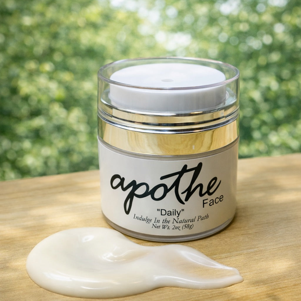 Jar of apothe Face cream with a spoonful of cream on a wooden surface with a blurred green background