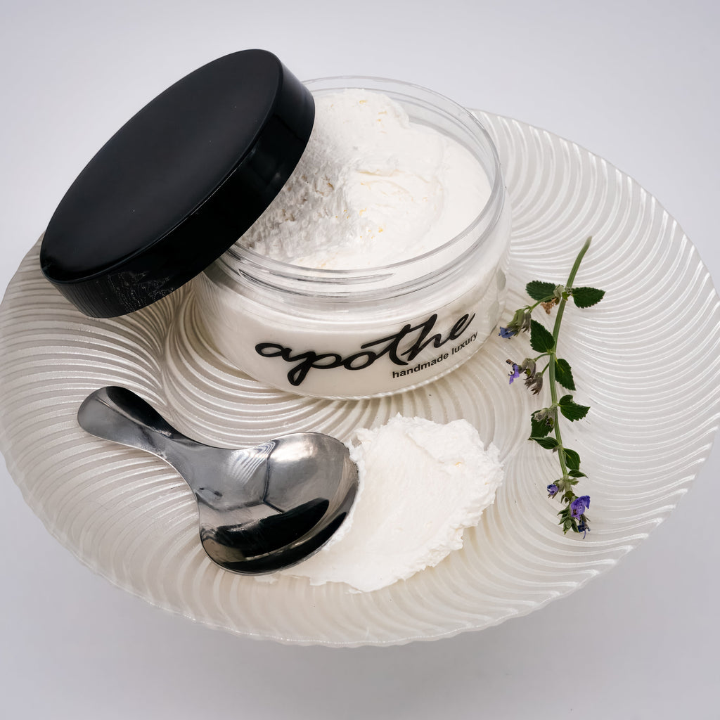 A jar of our luxuriously creamy white body butter featuring mango and shea butters with rich, healing jojoba oil. Ultra-nourishing formula designed to moisturize, soothe and rejuvenate.