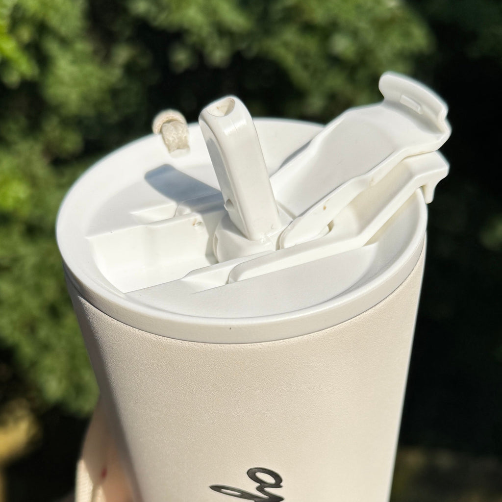 Close up of the straw of the white Apothe Tumbler cup